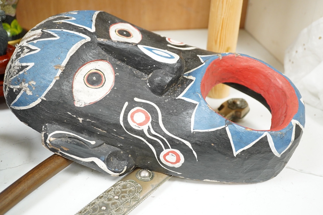 An African hardwood throwing club together with a painted mask and a Caucasian style dagger kindjal, largest 34cm high